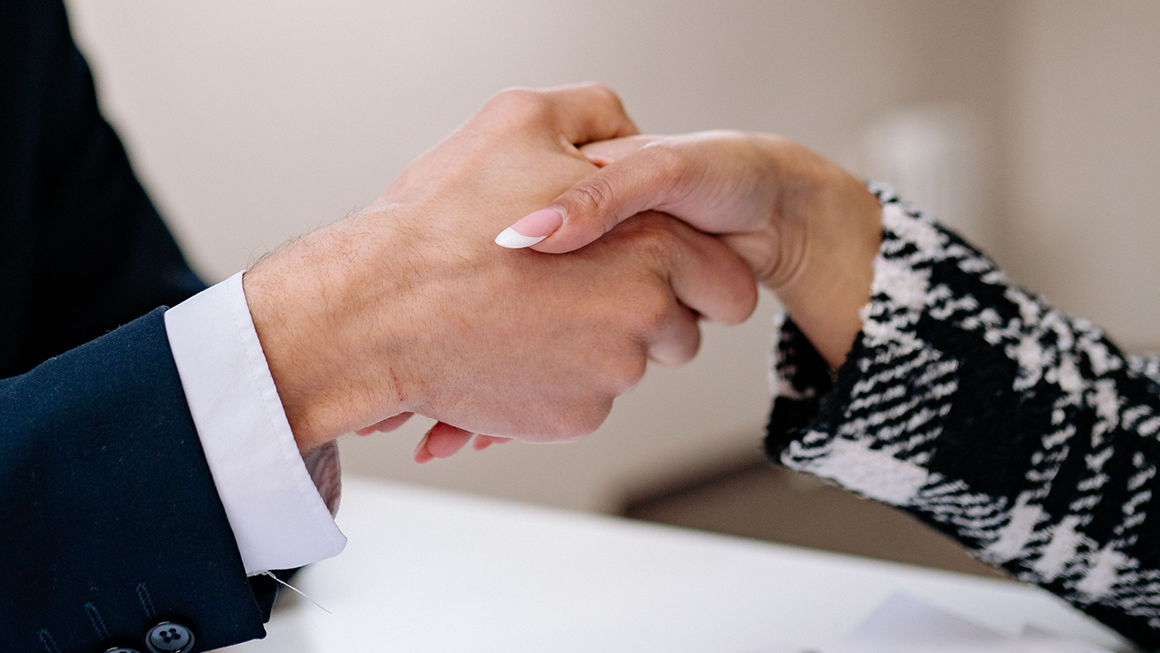 two people shaking hands