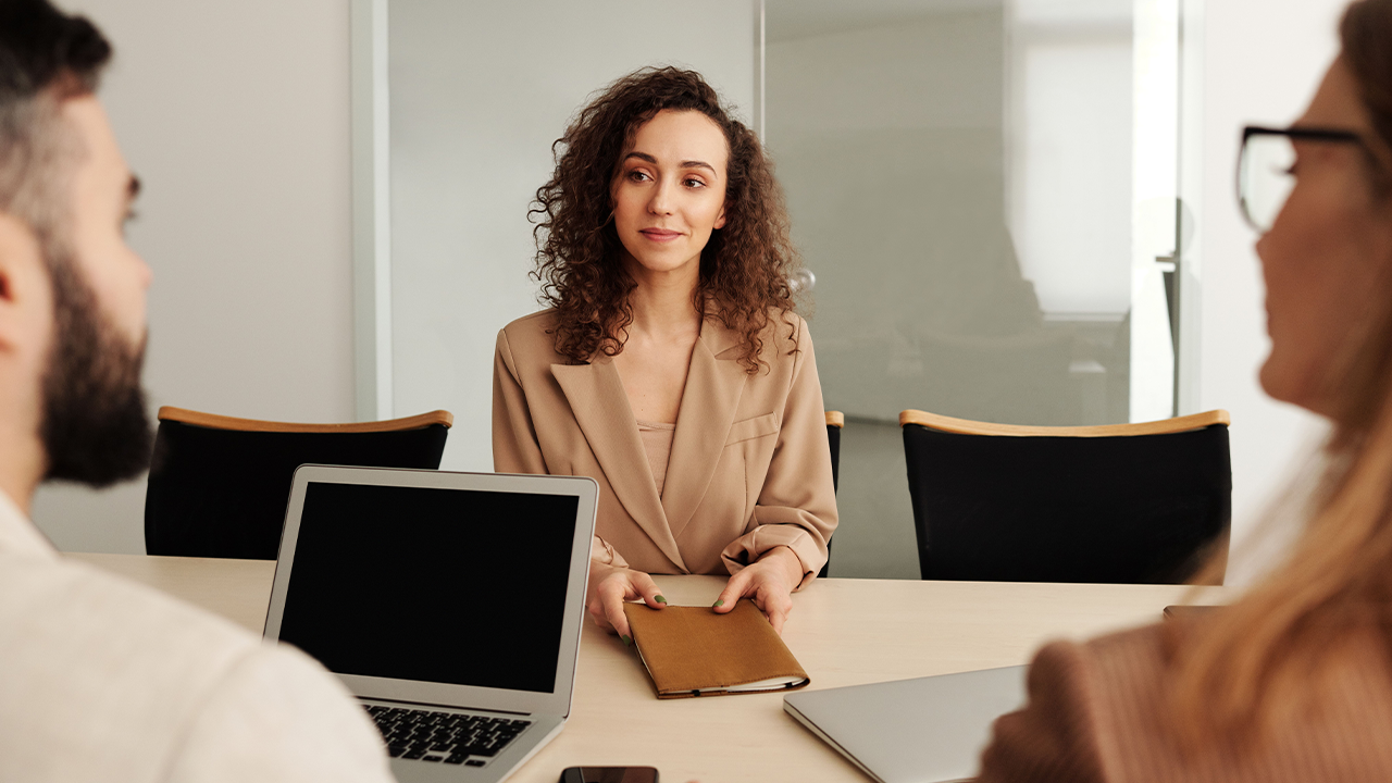 New employee sitting down to meet with team members