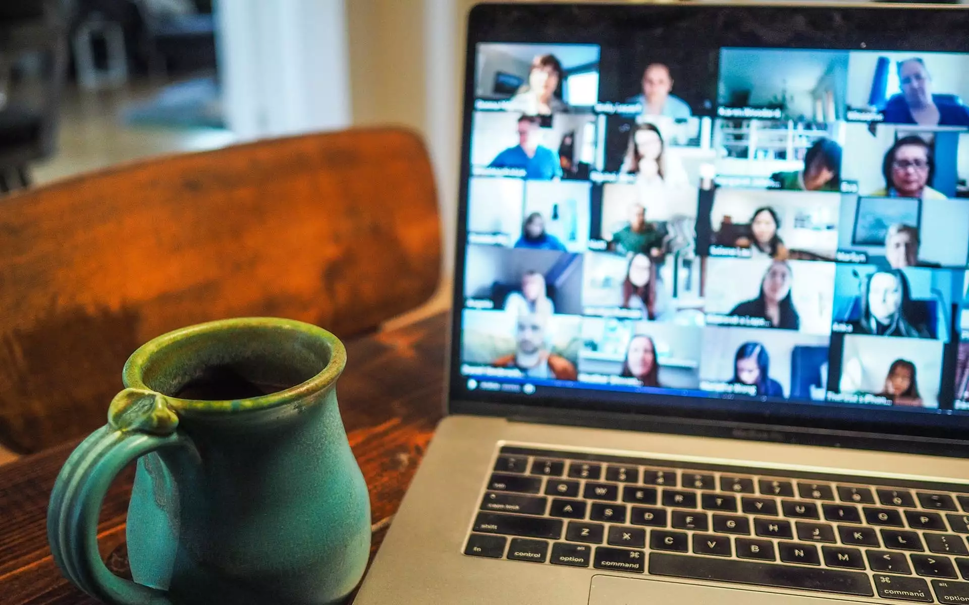 mug of coffee and virtual meeting on laptop
